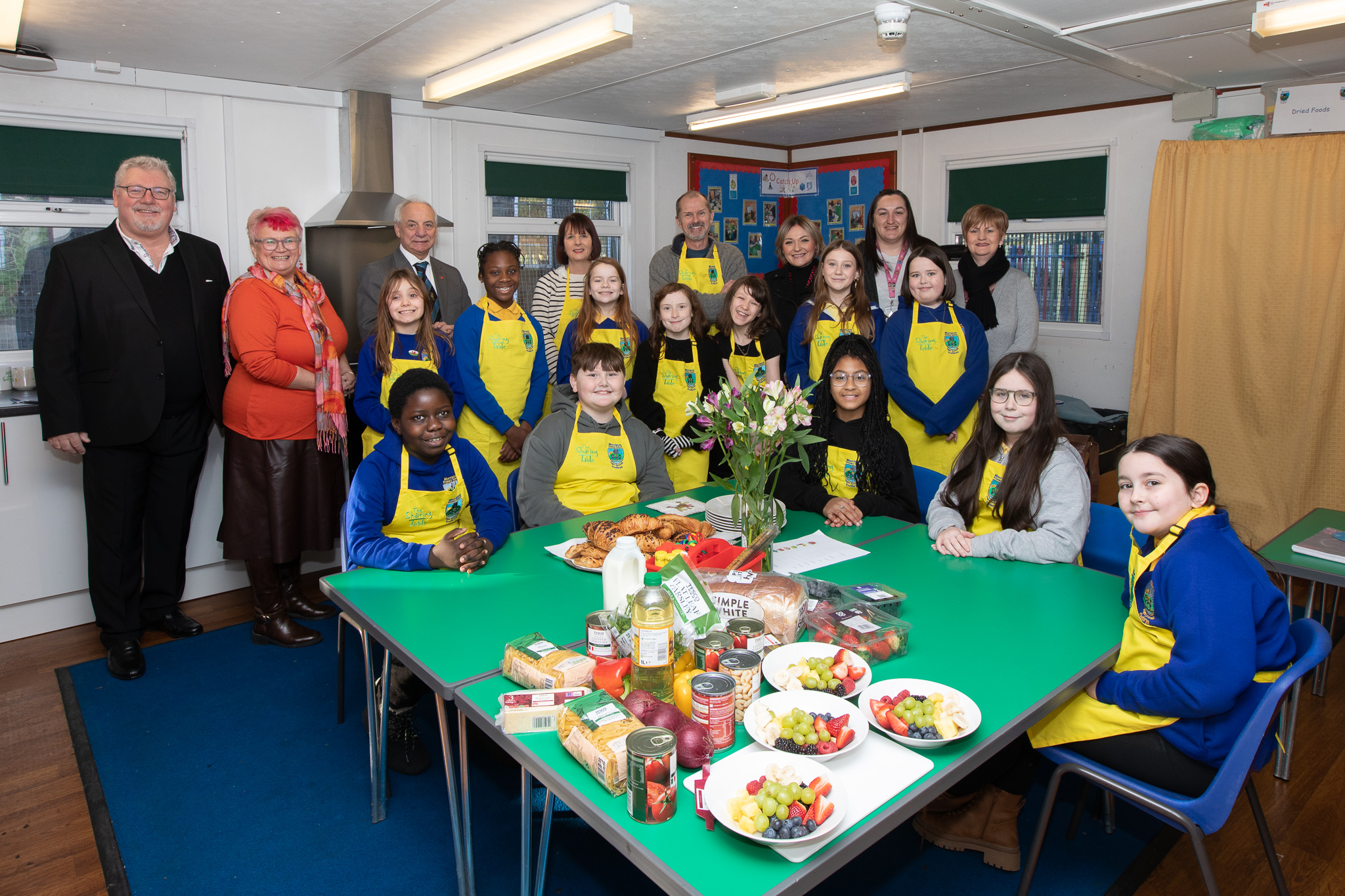 Peter Lynn, Carolyn Harris MP, Mike Hedges SM, Sian Brooks and Andrew Copson from The Sharing Table with pupils and staff from Morriston Primary School.