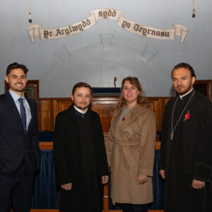 Alex Kurtz-Shefford with Diana Stroia, Fr. Vasile Flavian Branescu and Fr. Ioan Claudiu Moldovan.